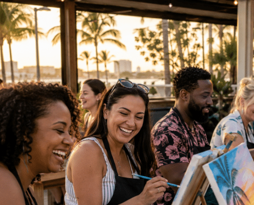 Friends enjoying a tropical paint and sip event on a Fort Lauderdale brewery patio