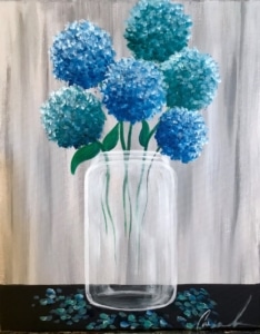 Blue hydrangea flowers arranged in a clear mason jar against a rustic wood background painted on a 16x20 canvas.