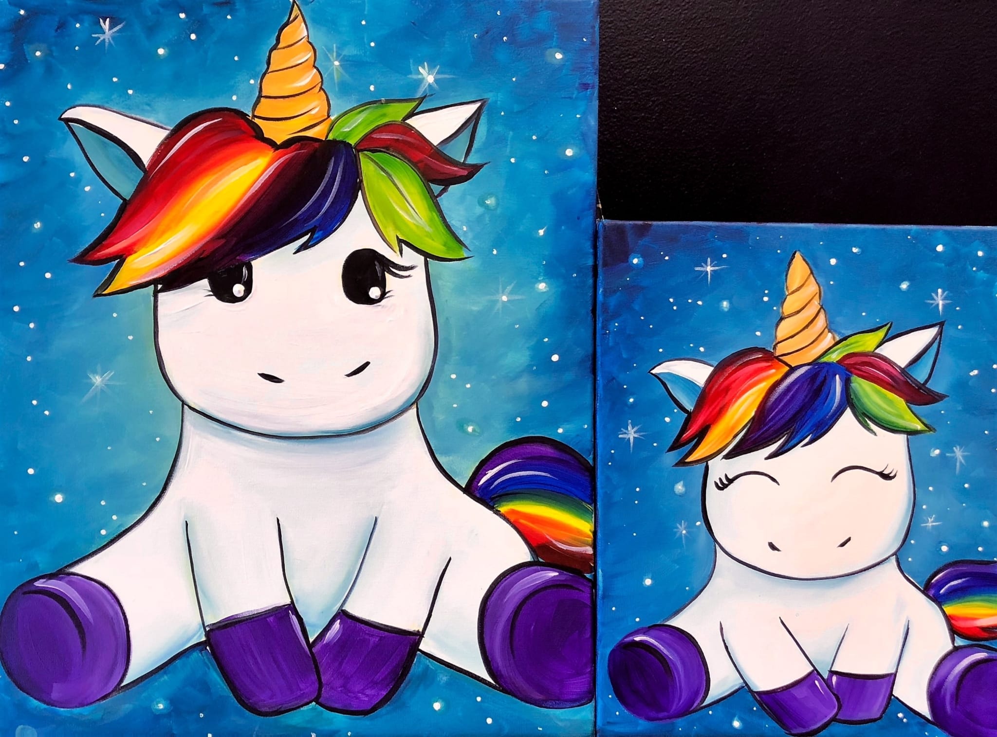 A parent and child paint matching rainbow unicorns on separate canvases during a Cookies & Canvas event, with cookies for each child.