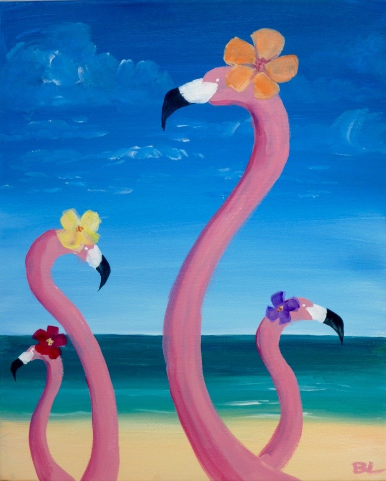 Four whimsical flamingos wearing colorful tropical flowers on their heads stand on a sunny beach, painted during a tropical-themed Paint & Sip Party.