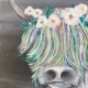 Highland Cow painting with rainbow hair and floral crown created at a Toledo Paint & Sip Party