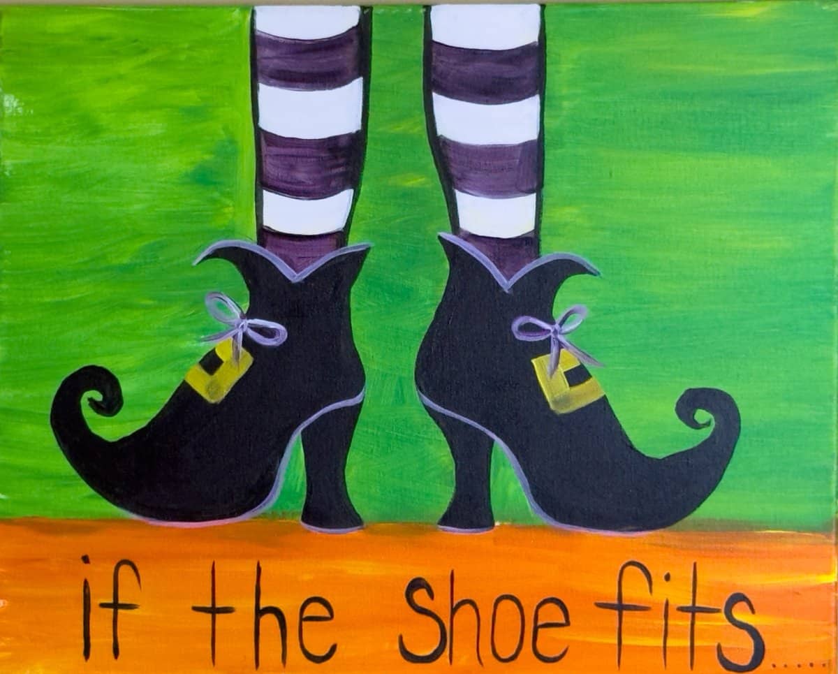 Painting of whimsical black witch shoes with striped stockings on green background and text If the Shoe Fits