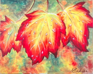 Three vibrant autumn leaves with dew drops on a colorful fall background – Wine & Canvas Toledo painting “Autumn Leaves”