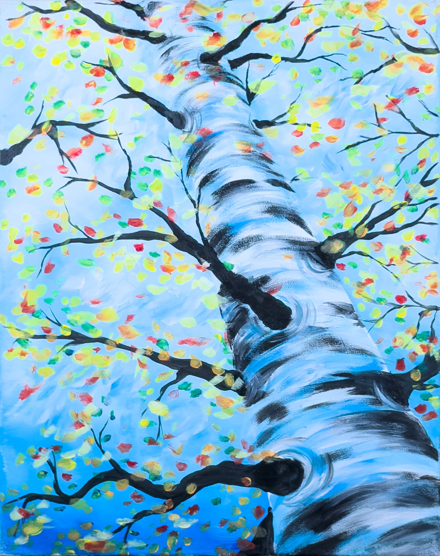 A tall birch tree with colorful autumn leaves against a bright blue sky – Wine & Canvas Toledo painting “Birch Blossom”
