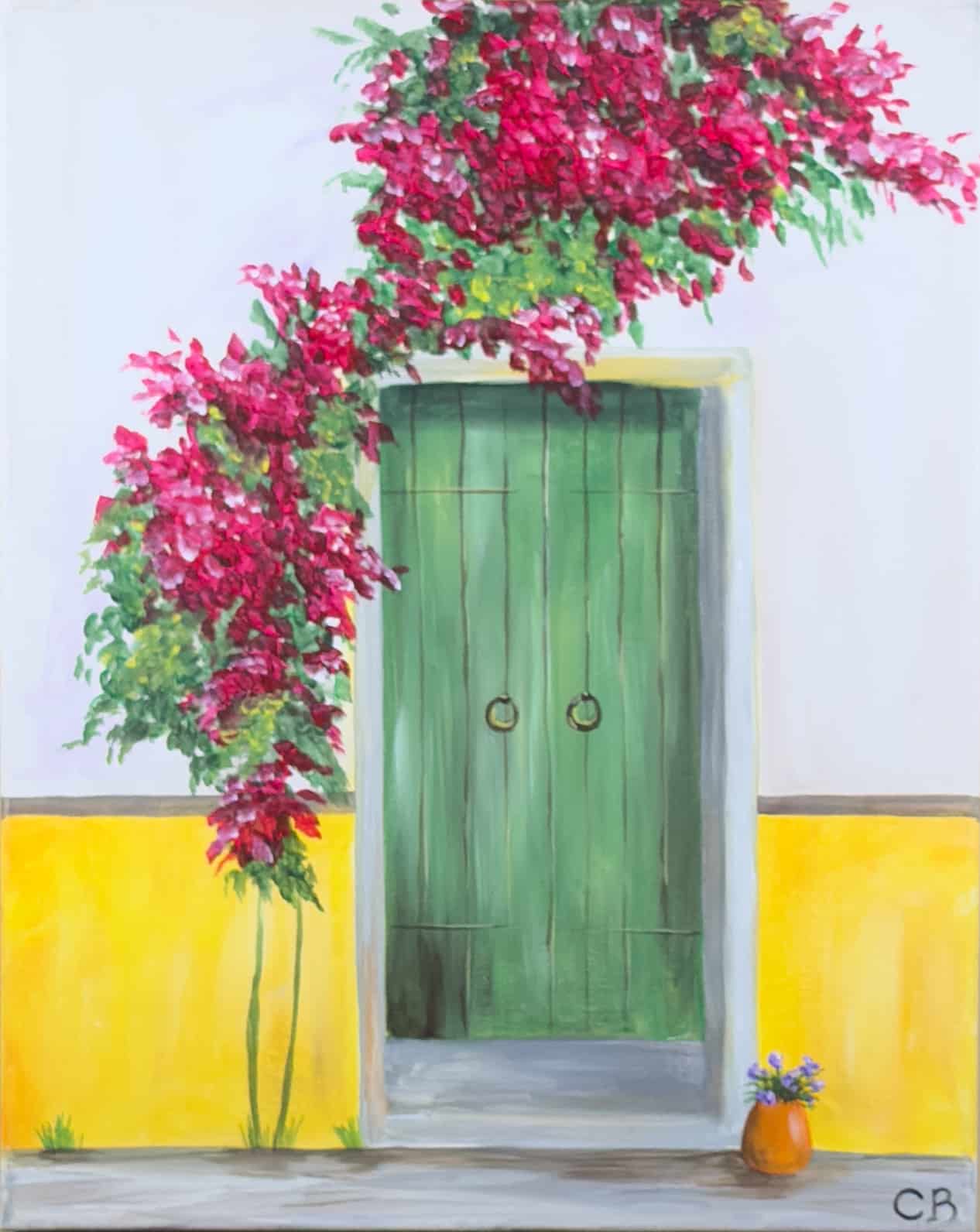 A charming green wooden door set into a bright yellow wall, framed by cascading pink bougainvillea vines, with a small potted plant resting on the stone doorstep.