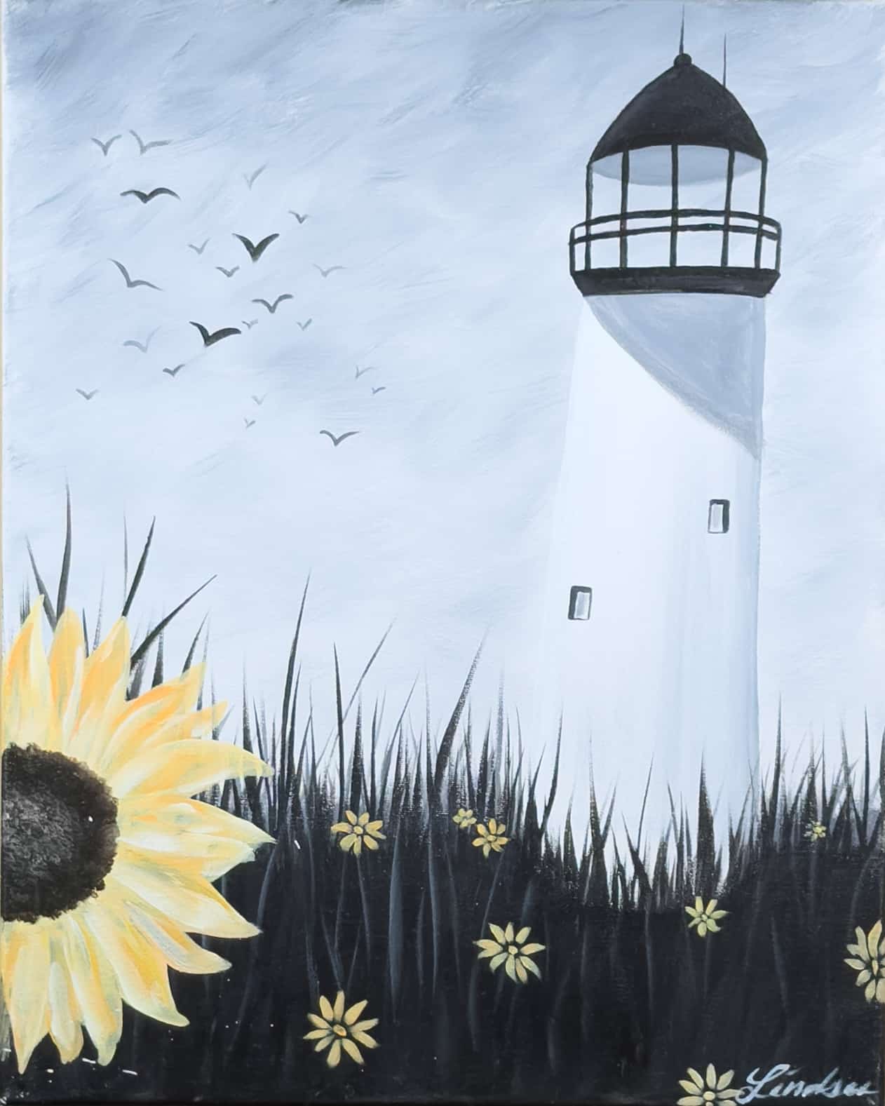 A tall white lighthouse rising above dark coastal grasses, with a large sunflower in the foreground and birds flying across a soft gray-blue sky.