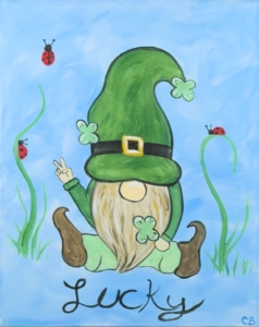 St Patrick’s Day gnome painting with green hat, shamrocks, ladybugs, and the word Lucky on a blue background