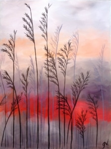 Tall, slender grasses silhouetted in the foreground against a softly layered sky, where muted grays and lavenders blend into a vivid band of warm red and coral, creating a calm yet glowing twilight atmosphere.