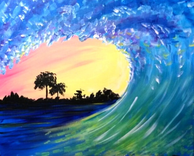 Ocean wave curling at sunset with blue water and glowing yellow sky on the horizon.