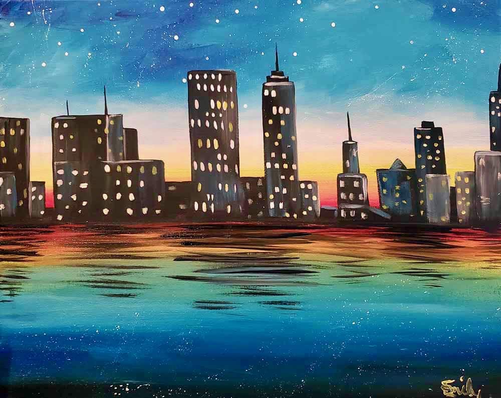 Colorful city skyline at sunset with glowing windows and reflections on water under a starry sky