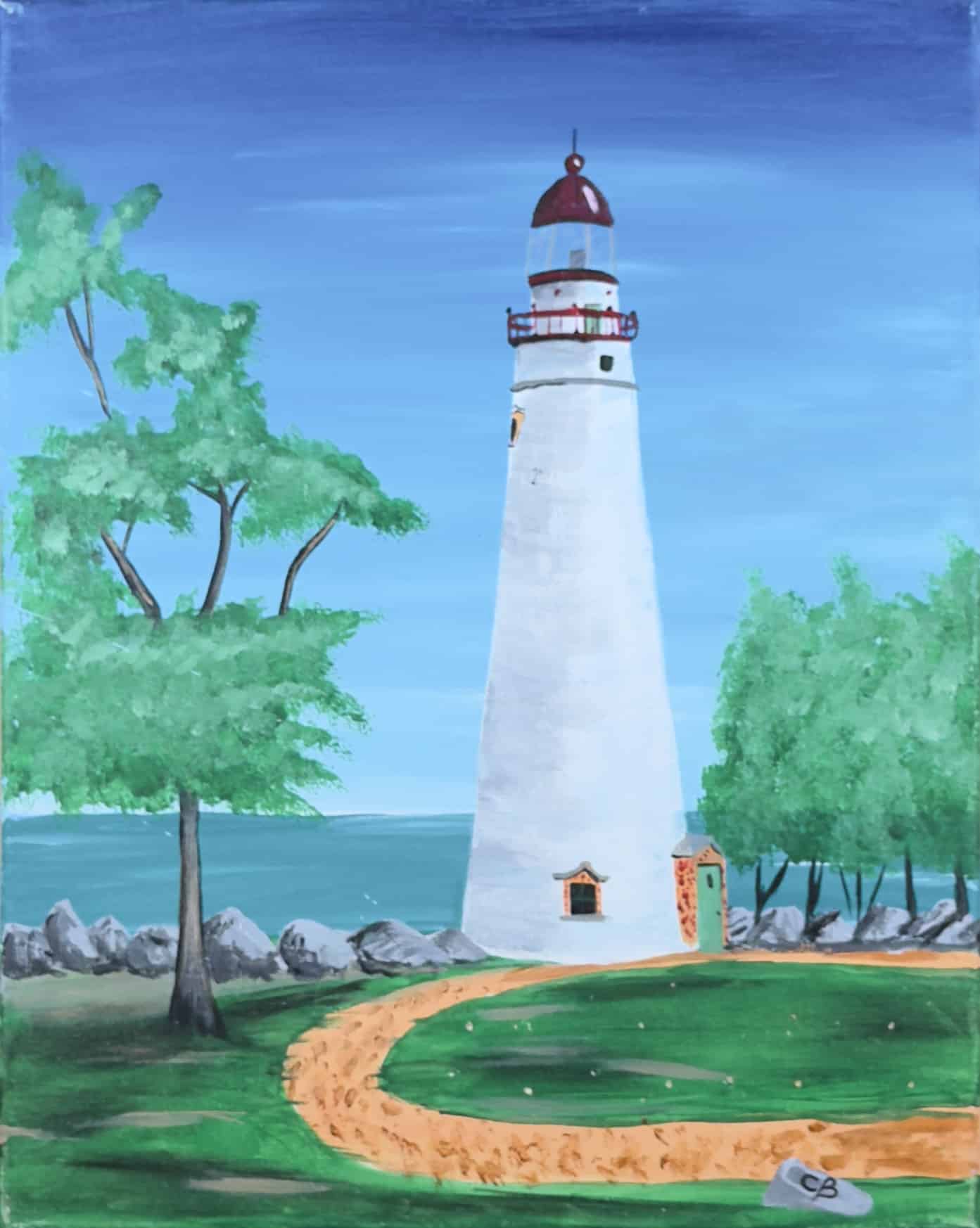 White lighthouse by the water with trees and a winding path under a soft blue sky