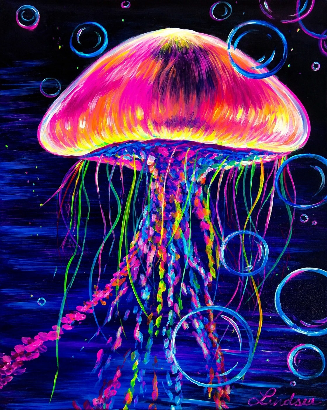 Bright neon jellyfish glowing beneath blacklight with colorful tentacles and floating bubbles against a dark underwater background.